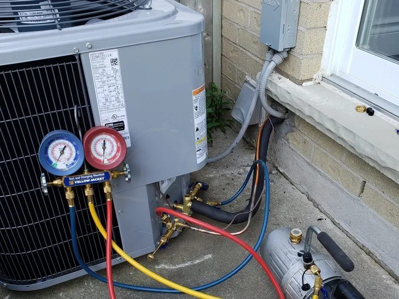 AC condenser unit being serviced at a Guelph home
