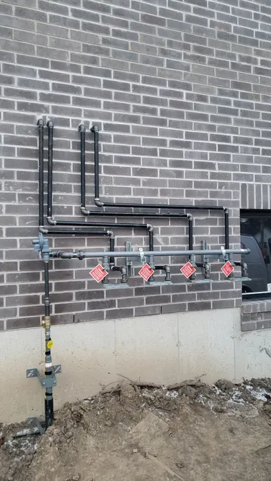 Heat pump system installed on the side of a house