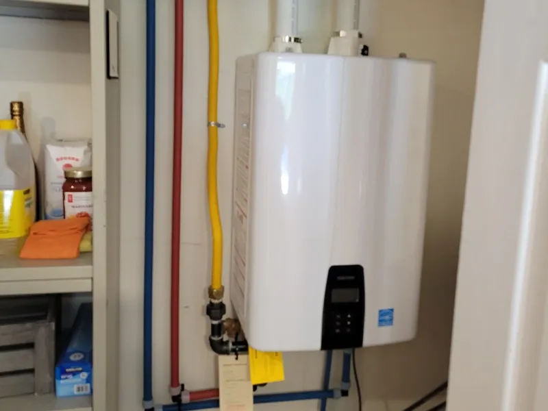Wall-mounted Navien tankless water heater installed in a Kitchener-Waterloo home