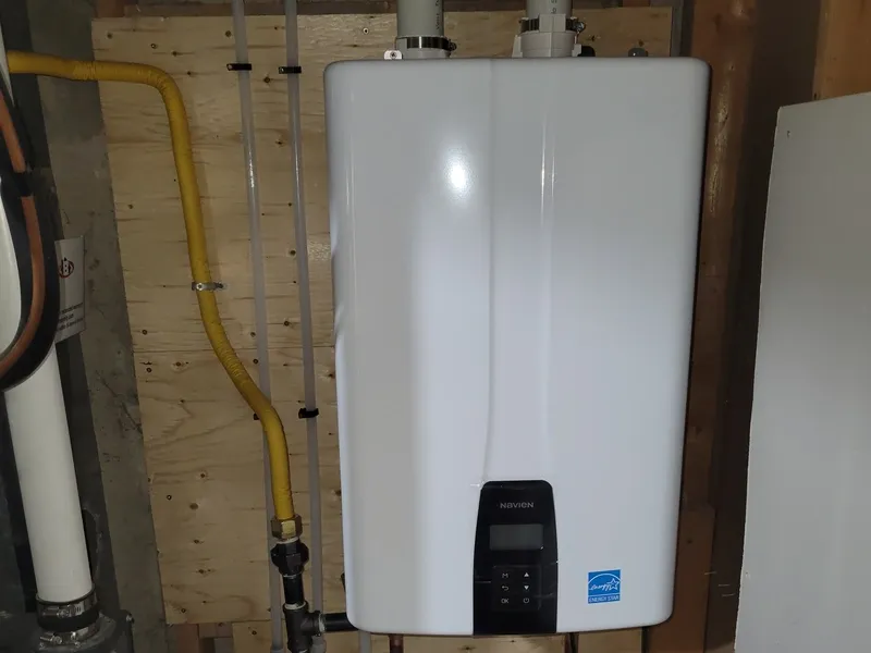 Tankless water heater being flushed with vinegar for descaling